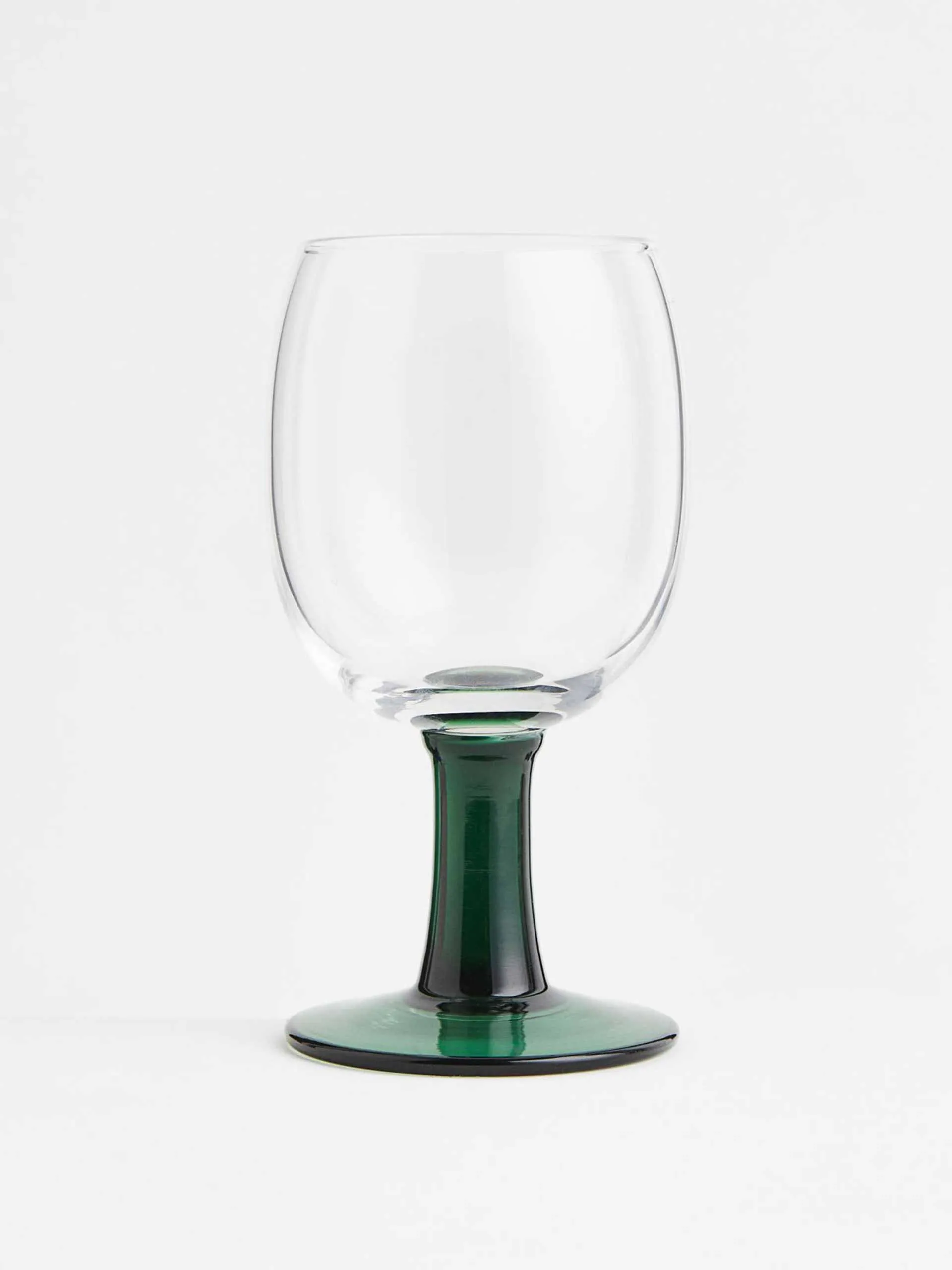 Clear and dark green wine glass